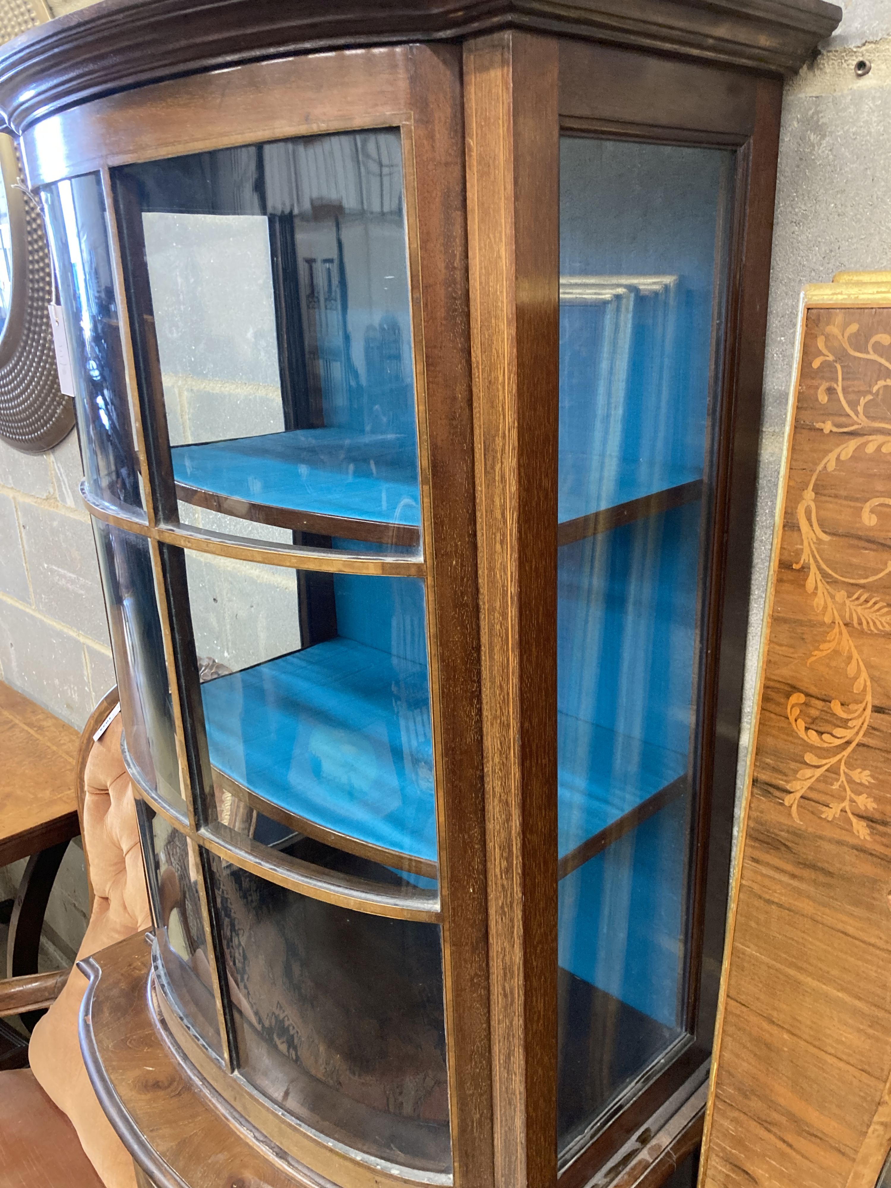 An Edwardian mahogany bowfront narrow display cabinet, width 60cm, depth 36cm, height 164cm
